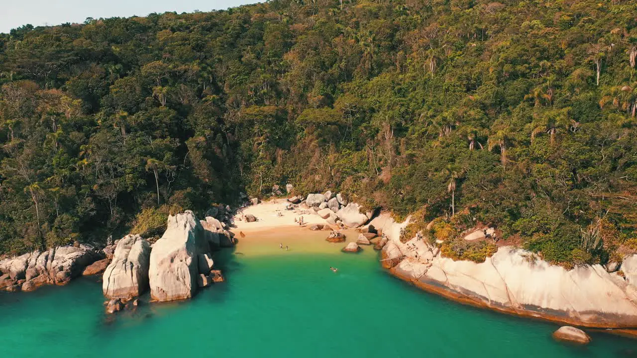 Aerial view approaching a brazilian secret paradise beach with turquoise color water located in Bombinhas Santa Catarina Brazil