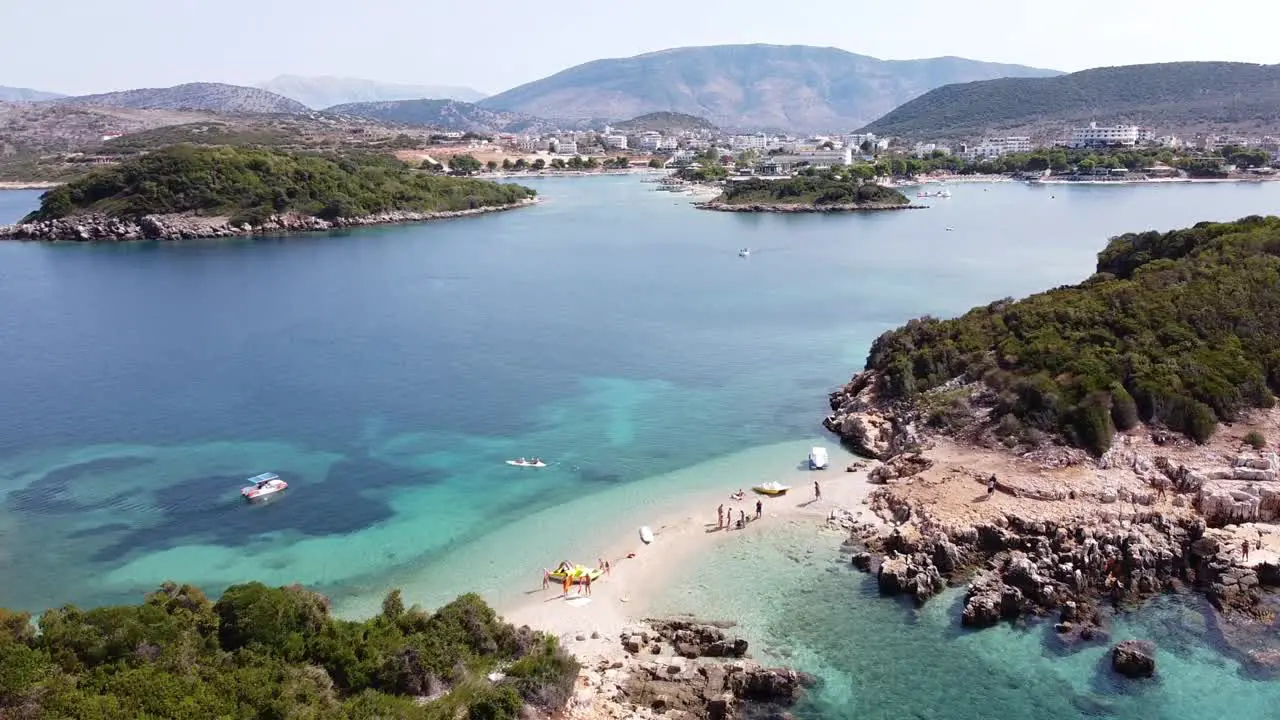 People Relax at Small White Sand Strip at Ksamil Islands Albania Aerial