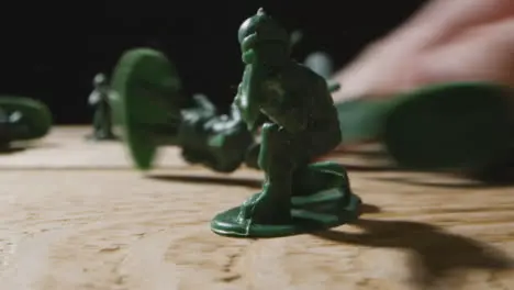 Tracking Shot of Toy Soldiers Being Knocked Down