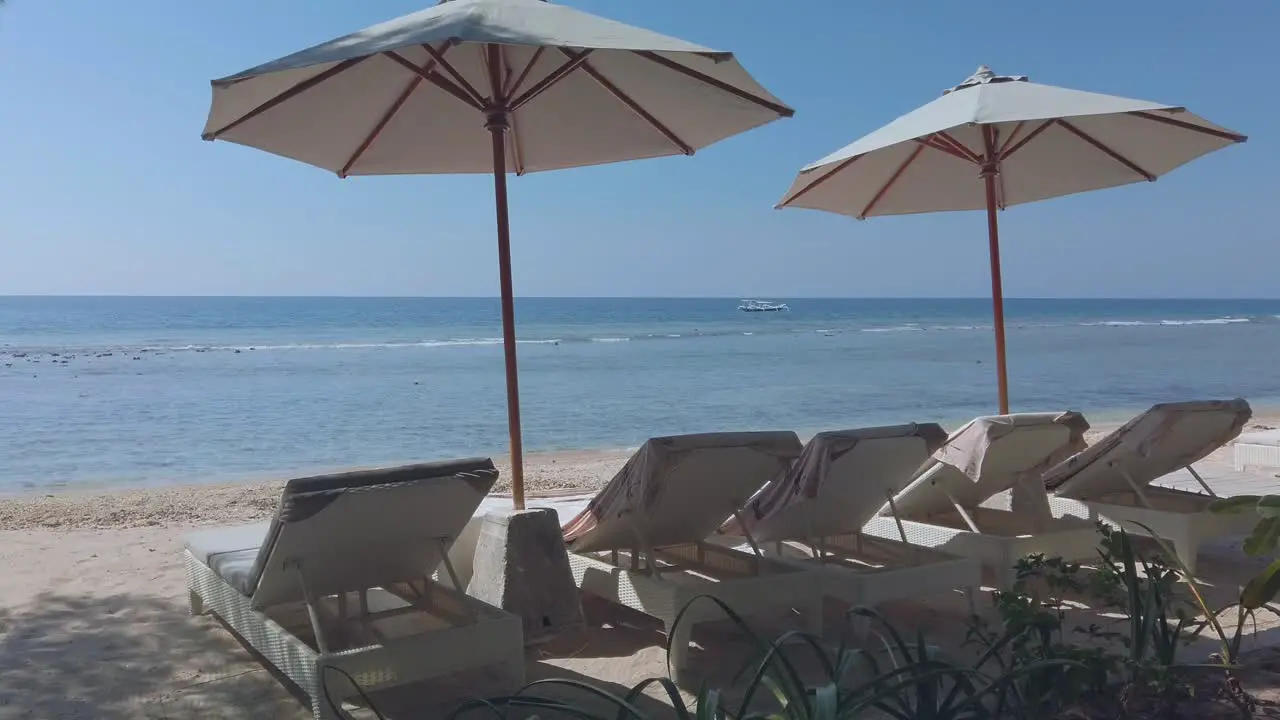 sun beds and umbrellas in Gili Trawangan beach Bali Indonesia