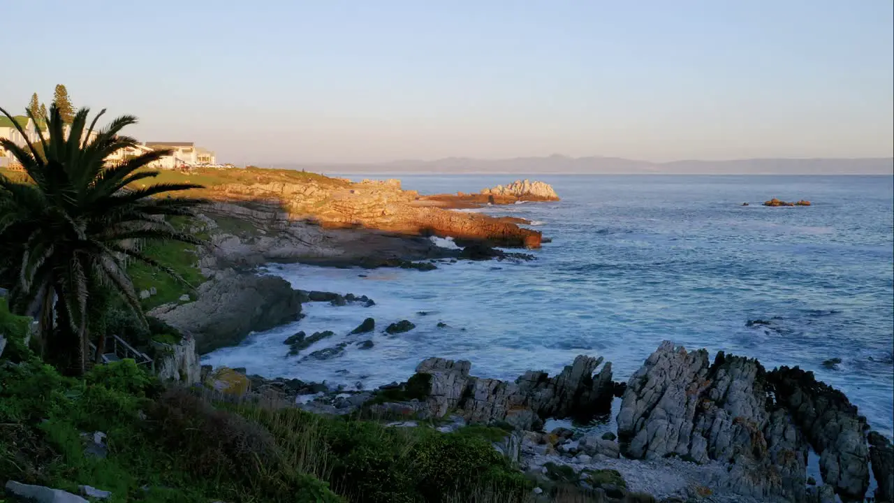 Timelapse of waves rolling in to bay with very rocky shore in the beautiful Hermanus South Africa