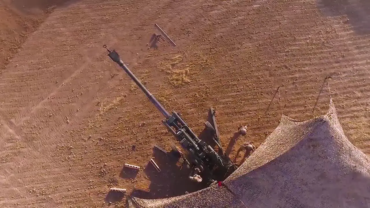 Aerial Of Soldiers Firing Heavy Artillery In The Battlefield 2