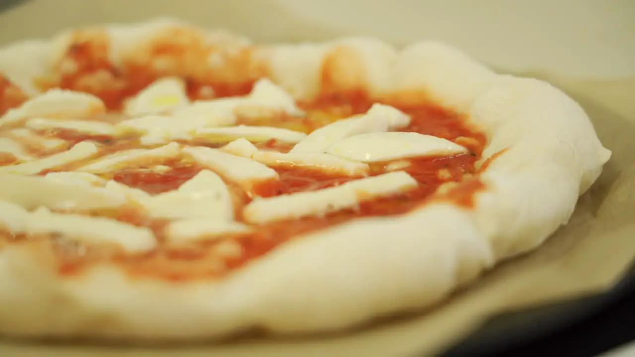 A delicious Margherita pizza while cooking sizzling and bubbling