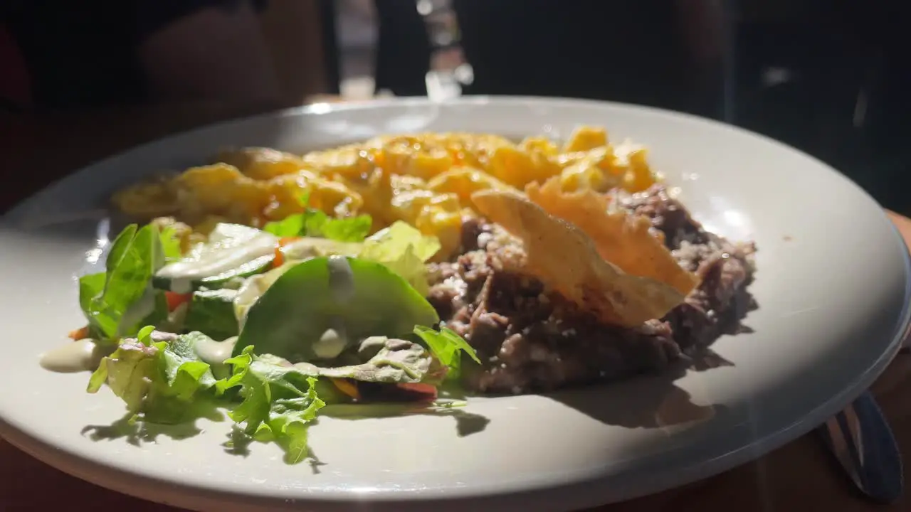 continental breakfast served on white plate at bar cafe restaurant