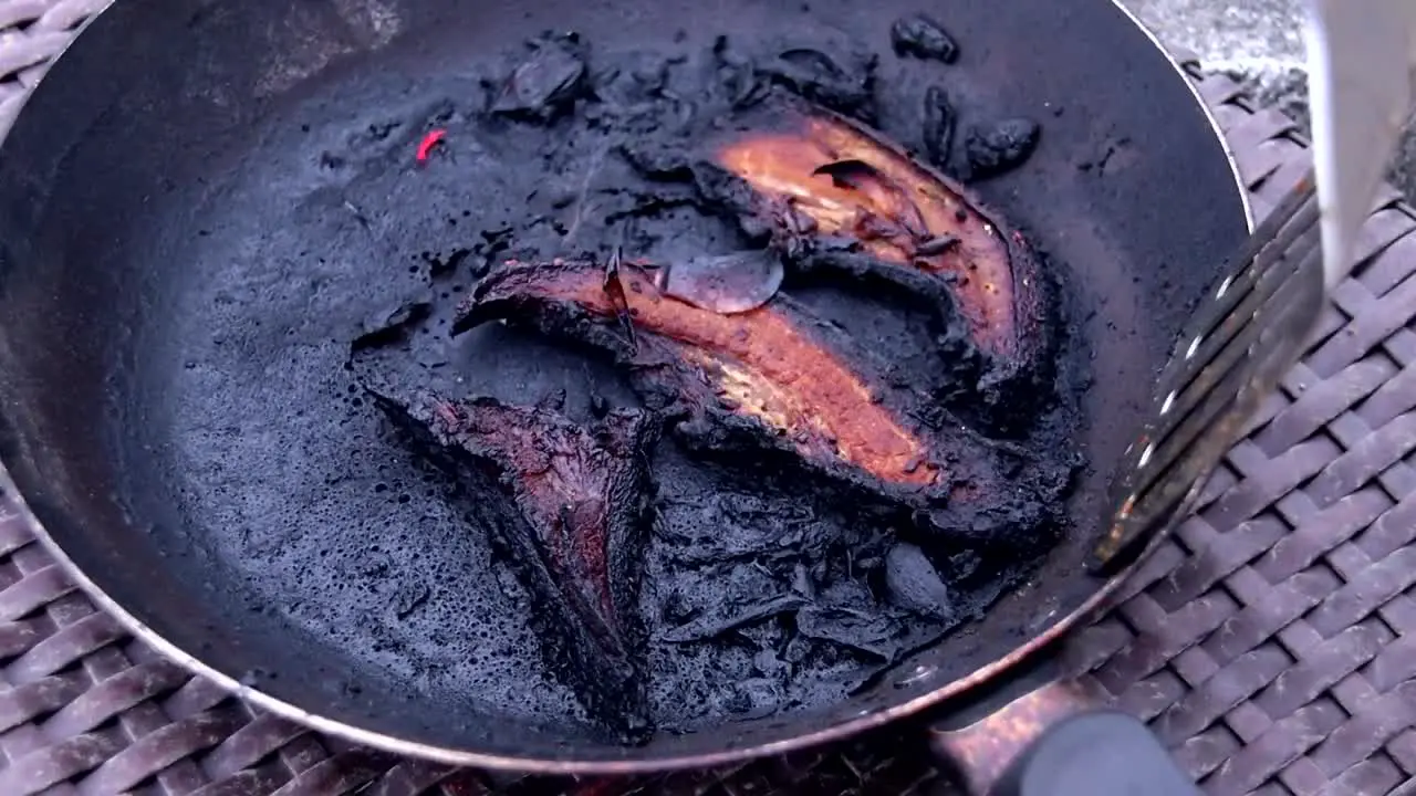 Burned meat in a burned pan