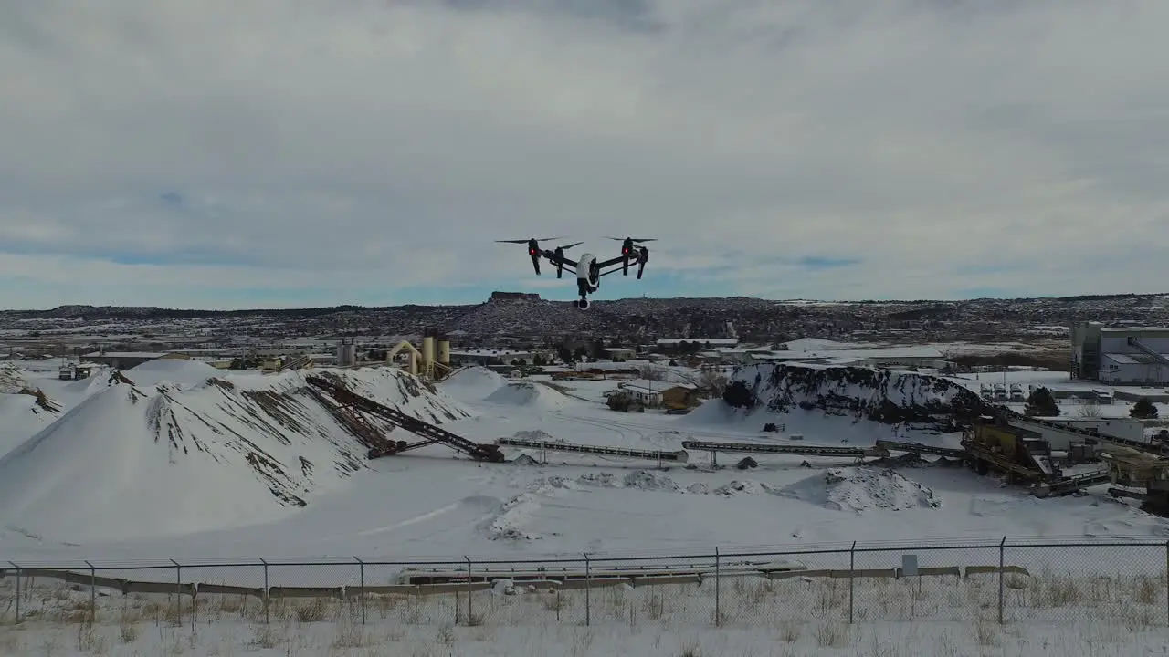 Aerial view of a drone filming a commercial field