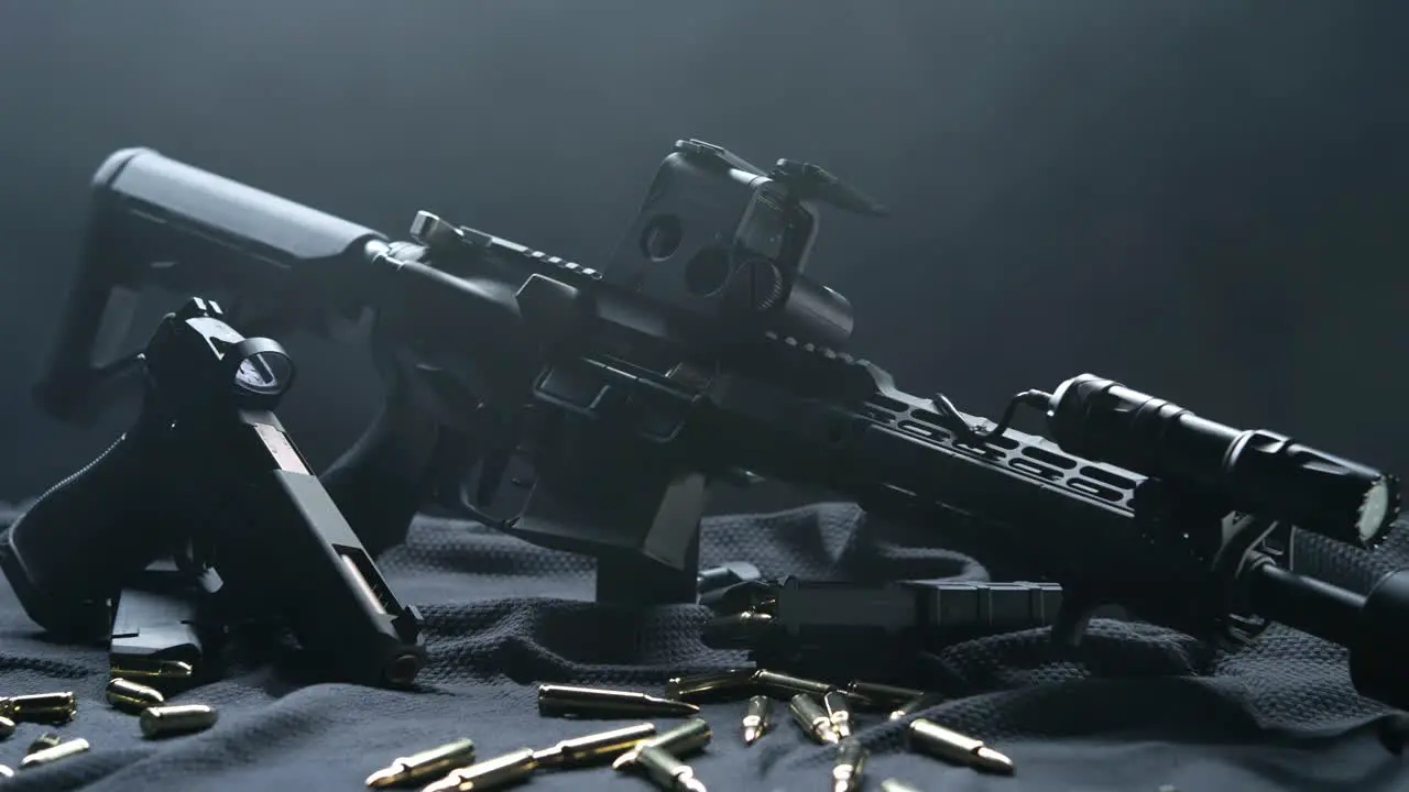 Rifle and Handgun on Table with Surrounding Bullets