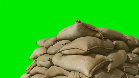 sandbags for flood defense or military use on green chromakey background