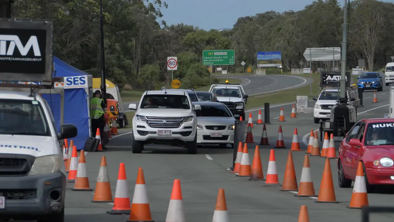 Car Stops And Asked The Policeman On The Checkpoint Cars From NSW Crossing The State Border In QLD Coronavirus Pandemic In Australia