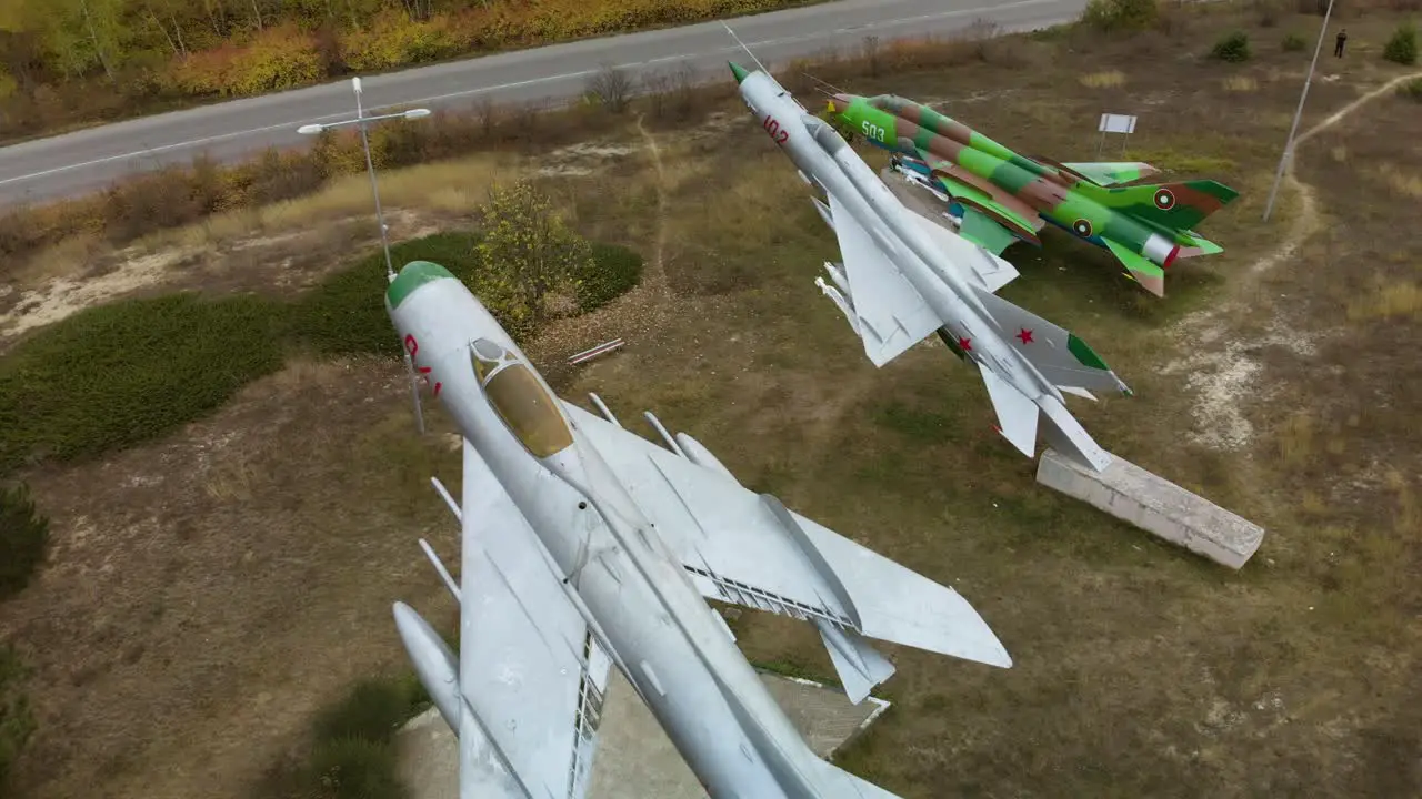 Aerial panning shot over airplane fighters exhibition