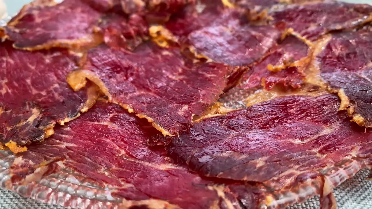 Delicious traditional Spanish Iberico pork cuts tasty delicatesse meat snack in Marbella Malaga Spain 4K shot