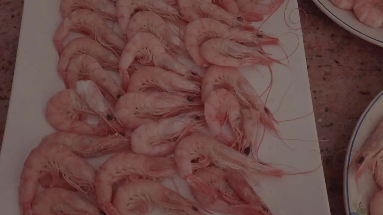 Plate of boiled pink shrimp Slow Motion Closeup Spinning Top Shot