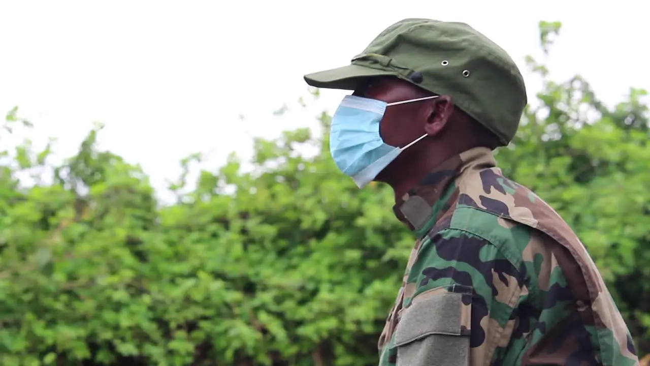 African militant guerilla soldier with covid mask on