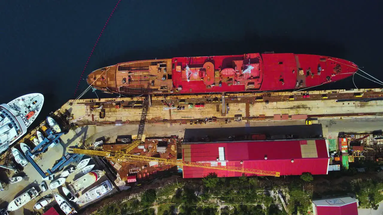 Incredible bird's-eye view from a drone of a bustling port complete with gigantic ships and towering cranes