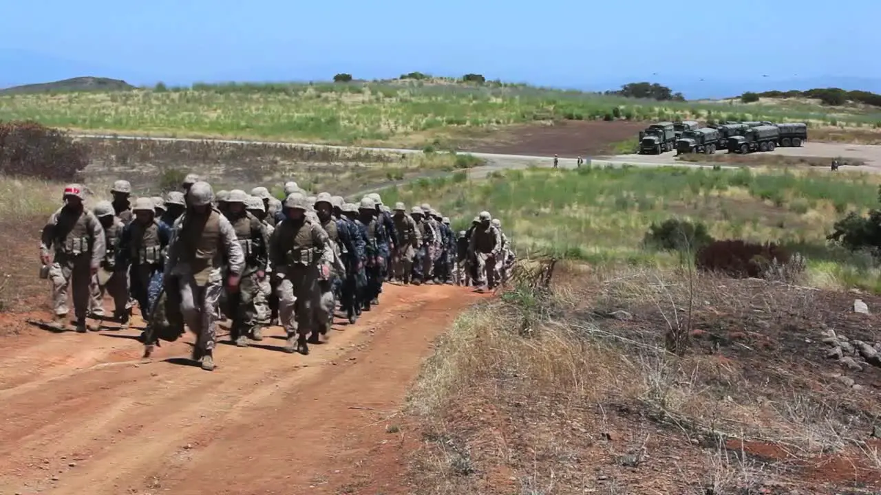 Us Marines March Uphill During Basic Training Exercises