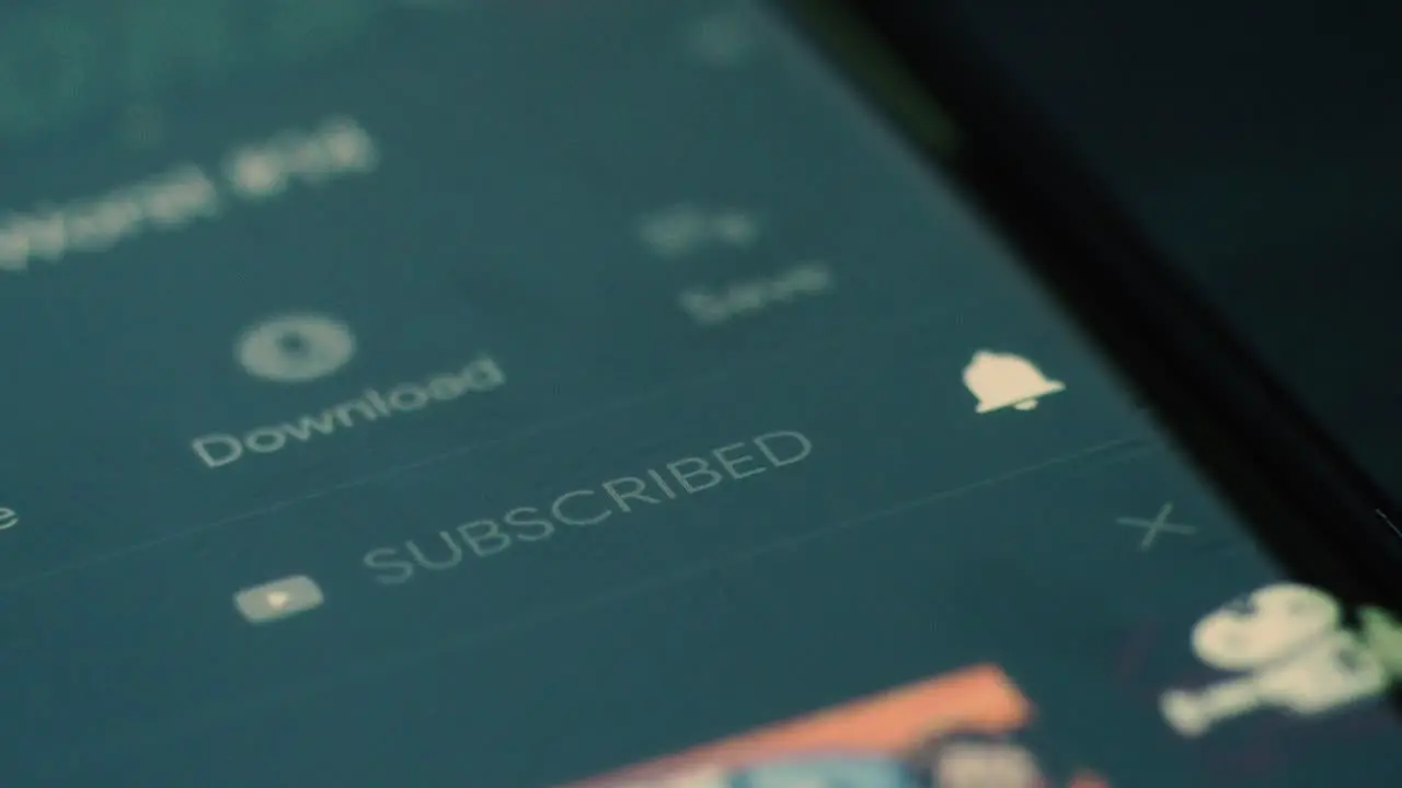 Closeup of person subscribing to youtube channel on Android smartphone Youtube App