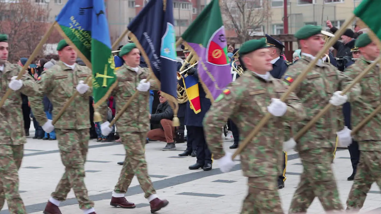 Soldiers carrying flags march in Great Union Day Parade Miercurea Ciuc Romania