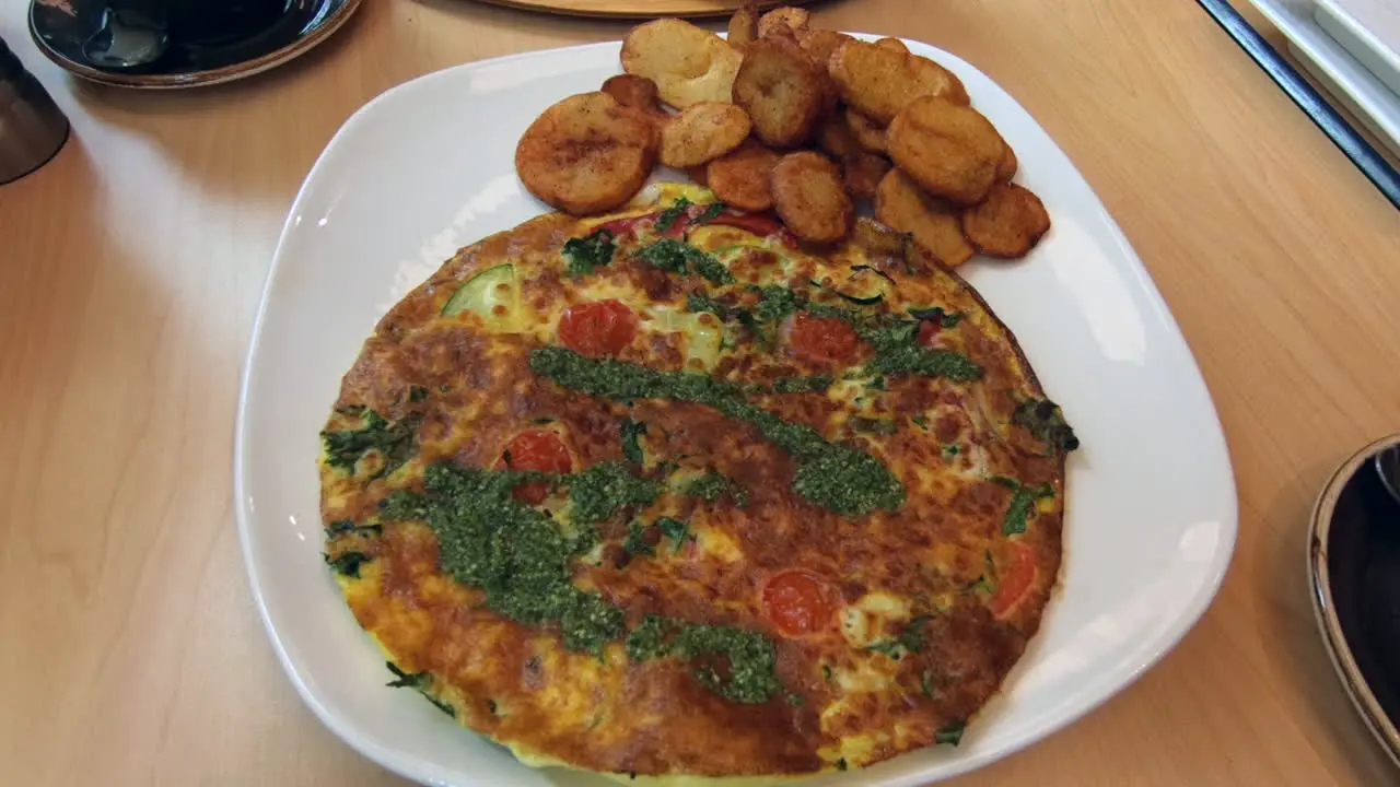 Omelette potato's  fries meal plate restaurant brunch lunch dinner nutrition food breakfast dish delicious healthy frittata vegetarian gastronomy