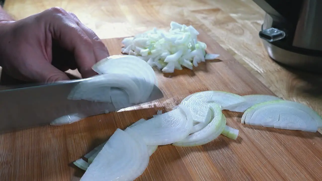 Timelapse of Slicing Onions on a Wooden Chopping Board