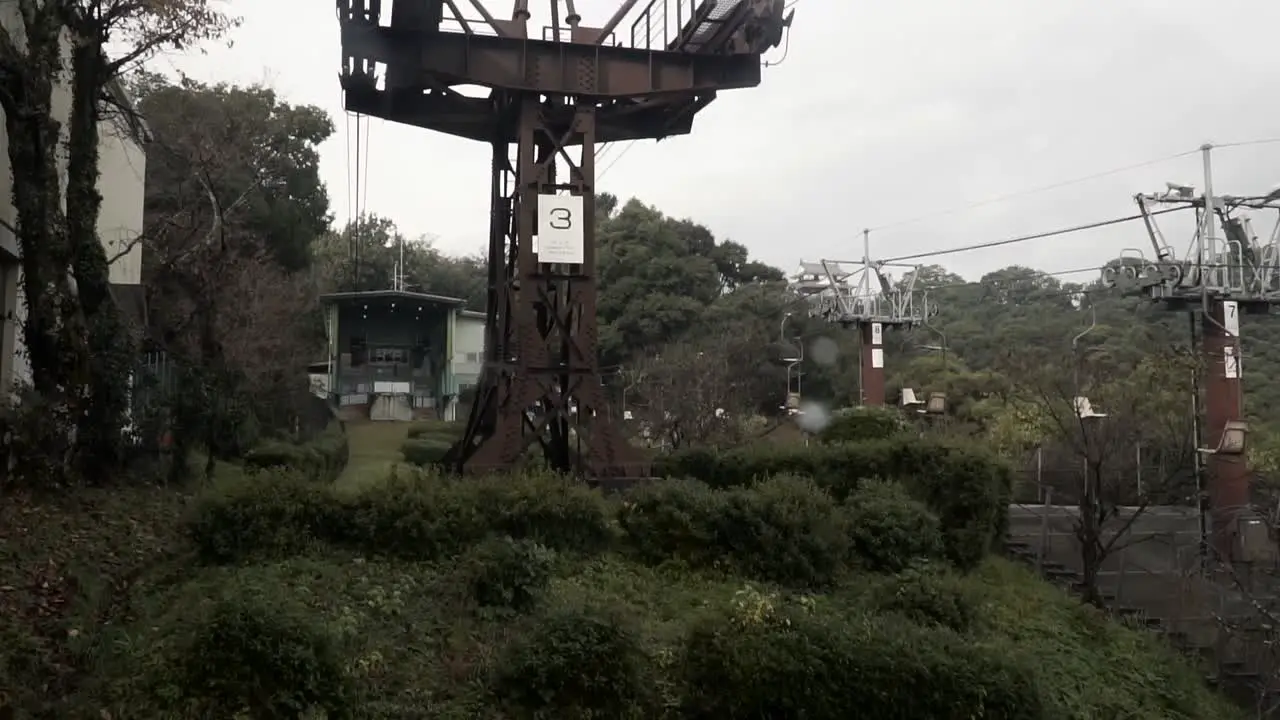 Front timelase view of Gondola going up hill on rainy day