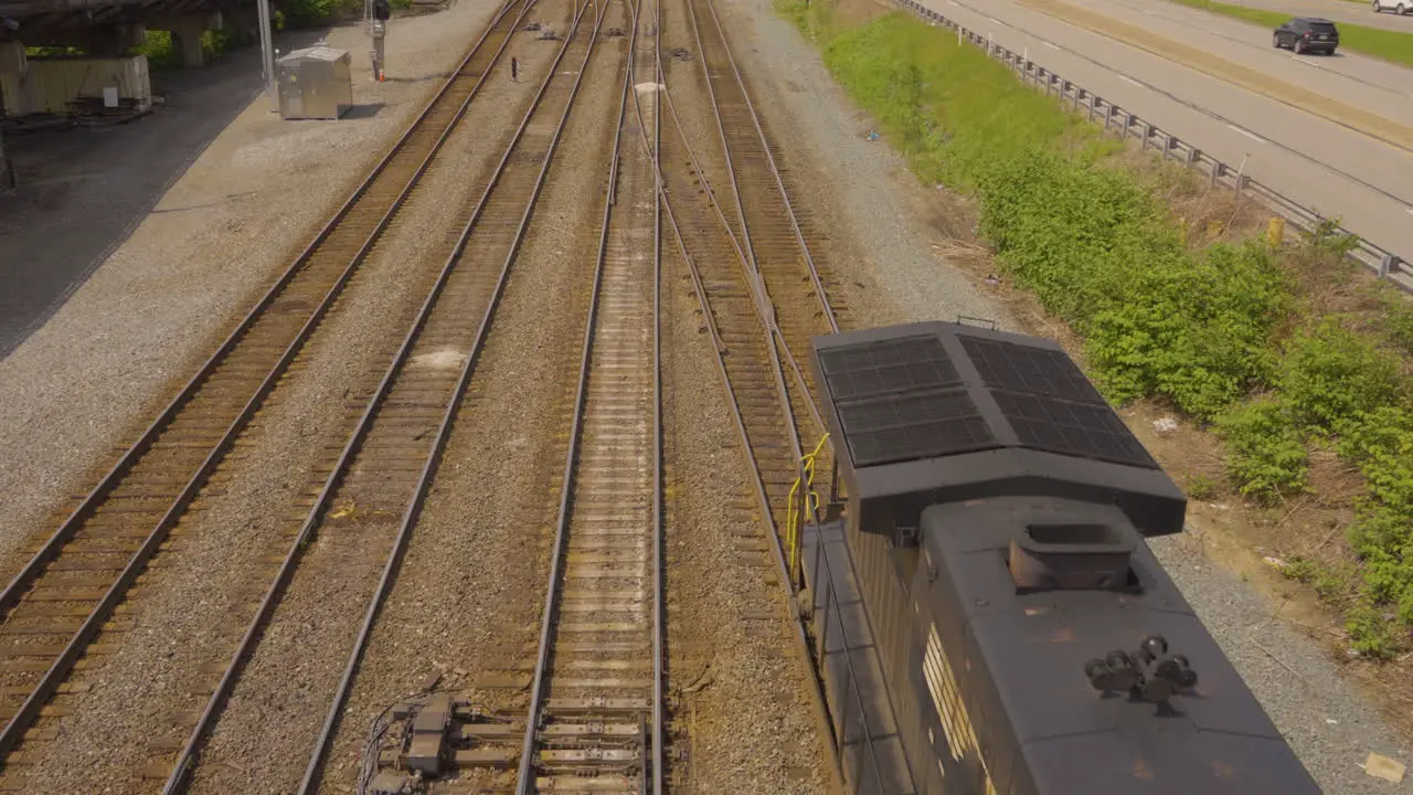 overhead view of a train entering the tracks at a railway intersection