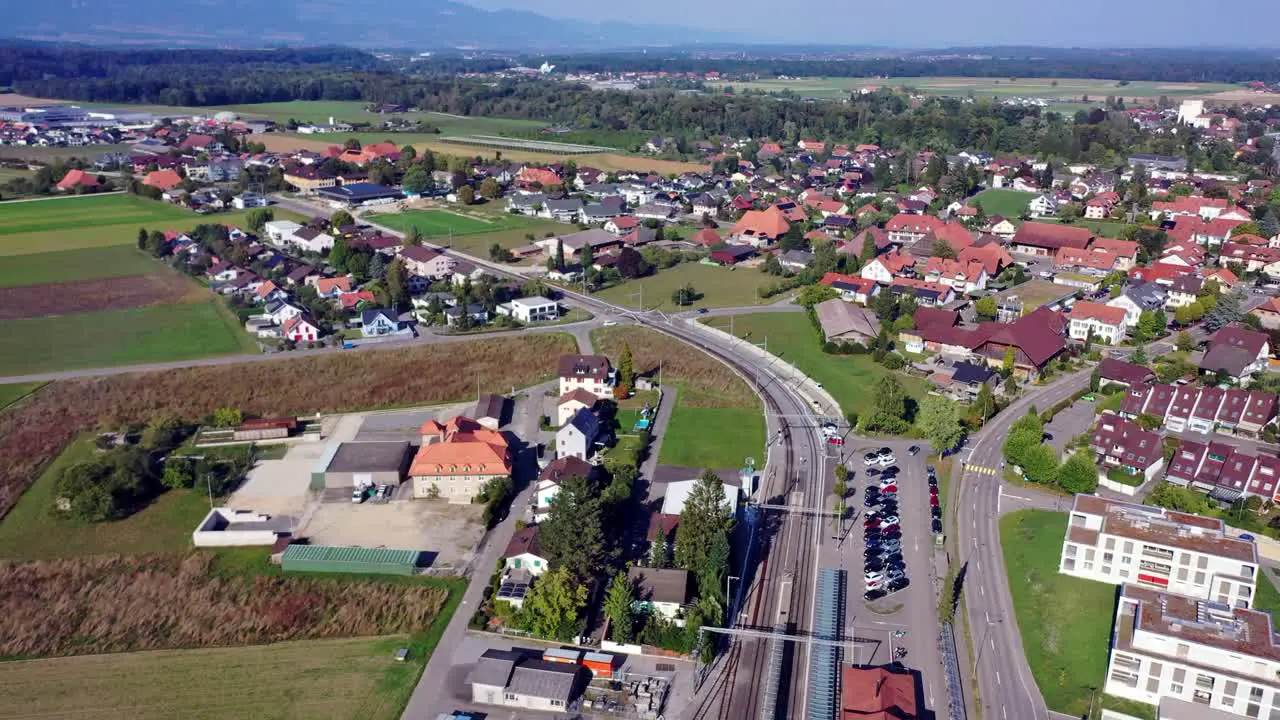 Baetterkinden in Switzerland from Above Capturing the Arrival of a Train with the drone