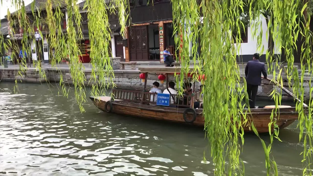 Tour Group Travelling By Chinese Traditional Boat In The Canal