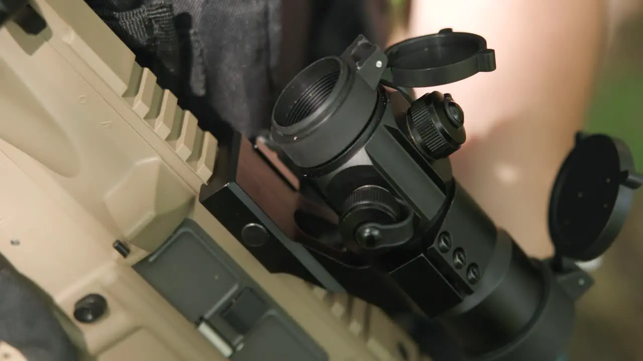 Detail slow motion shot of rifle scope