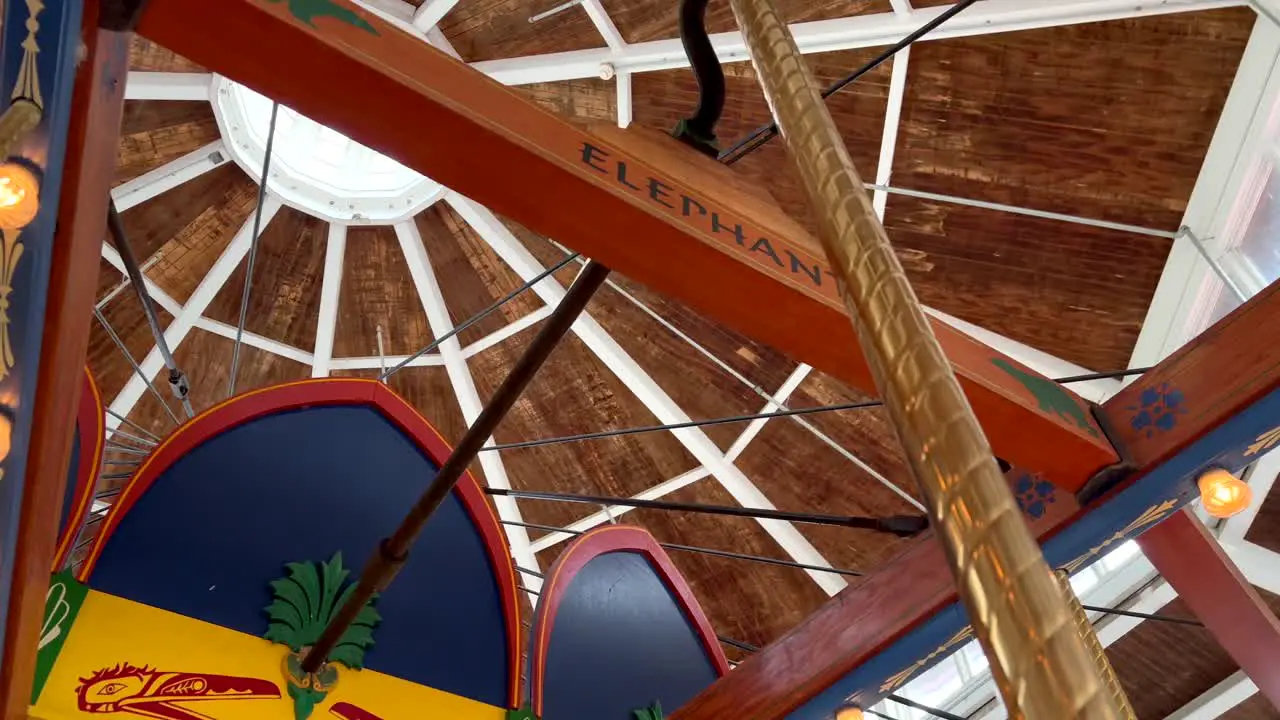 Sitting inside a carousel ride looking up establishing shot 4k