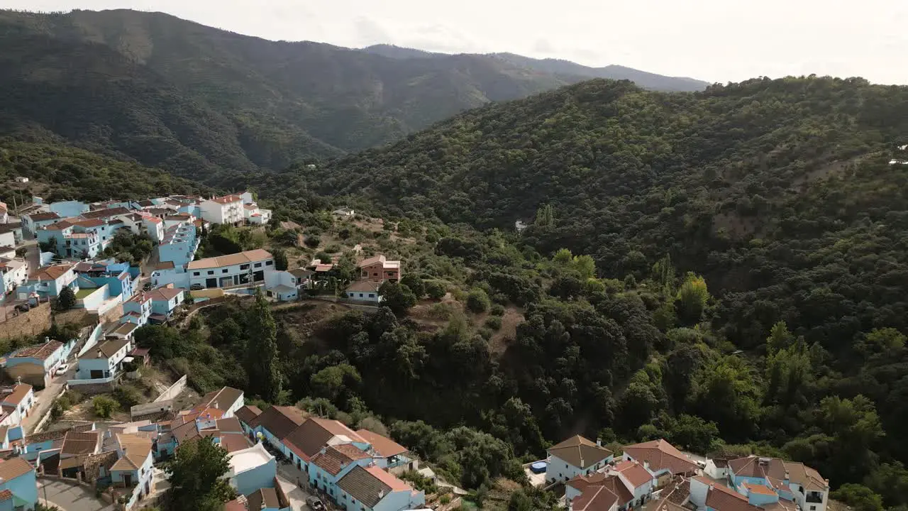 Beautiful mountain township on sunny day in Spain aerial view