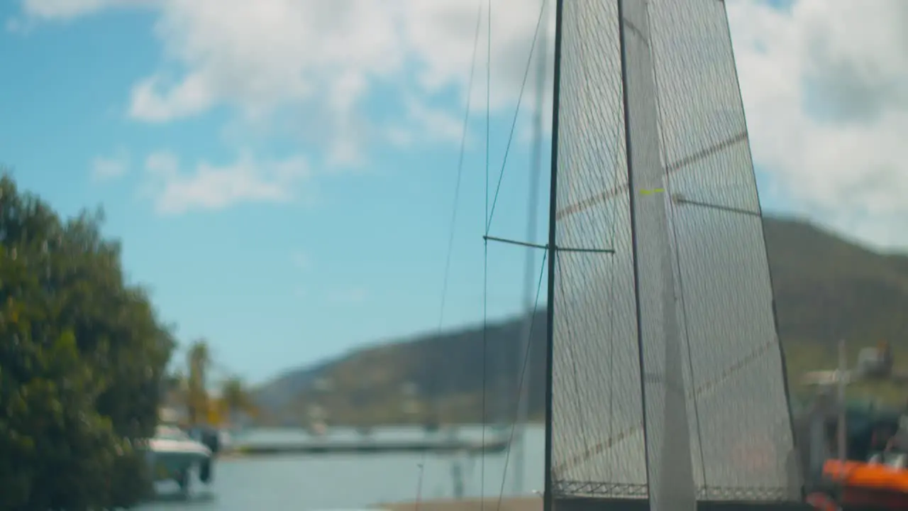 Tilt down reveal model RC boat on a wooden horse on a dock