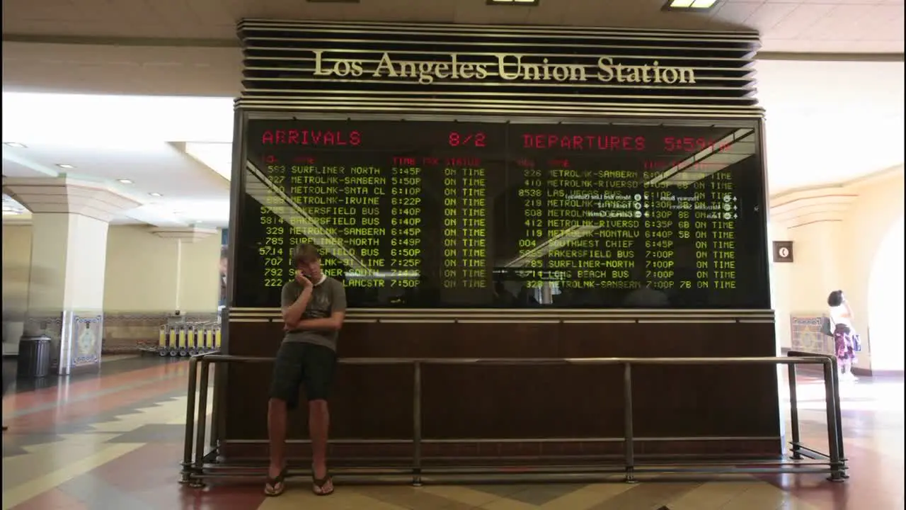 A time lapse of passengers looking at train arrivals and departures at the Los Angeles Union Station