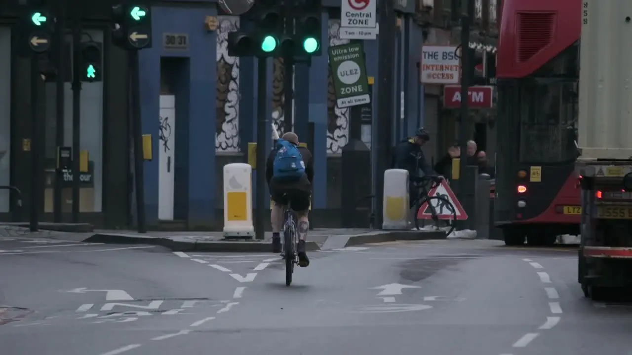 Cyclist on busy London main street slow motion