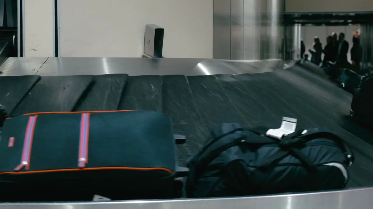 Travel bags on the conveyor belt at airport