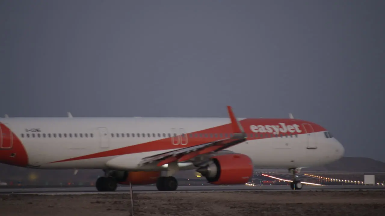 Airplane of EasyJet at the airport in the evening