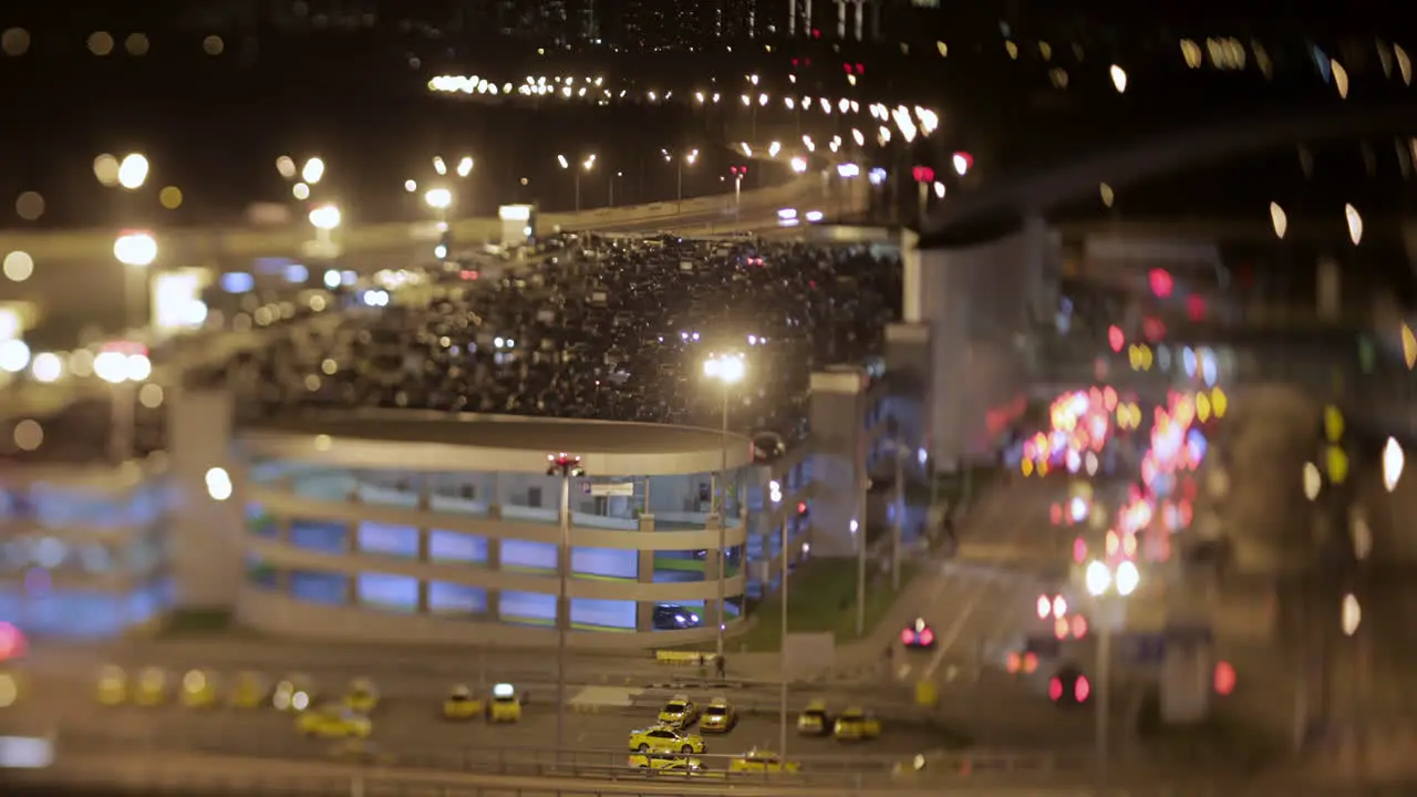 Timelapse night shot of car traffic near parking lot