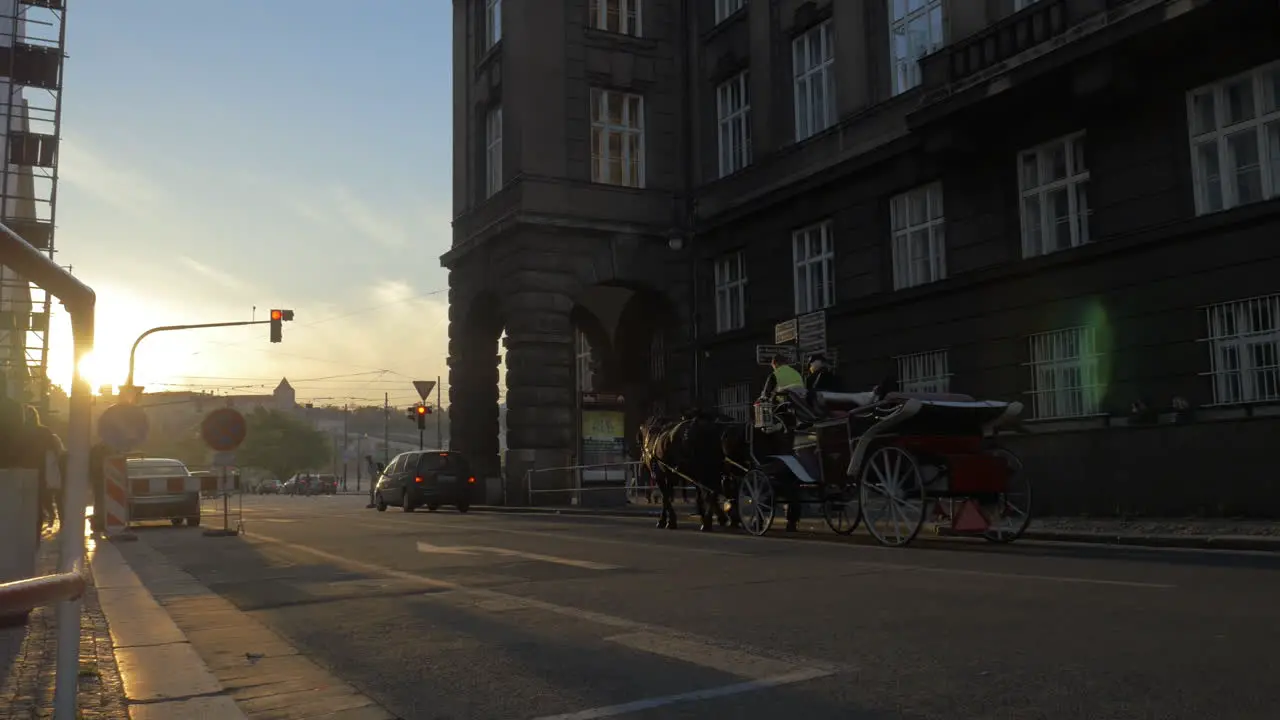 Prague street with car and horse carriage