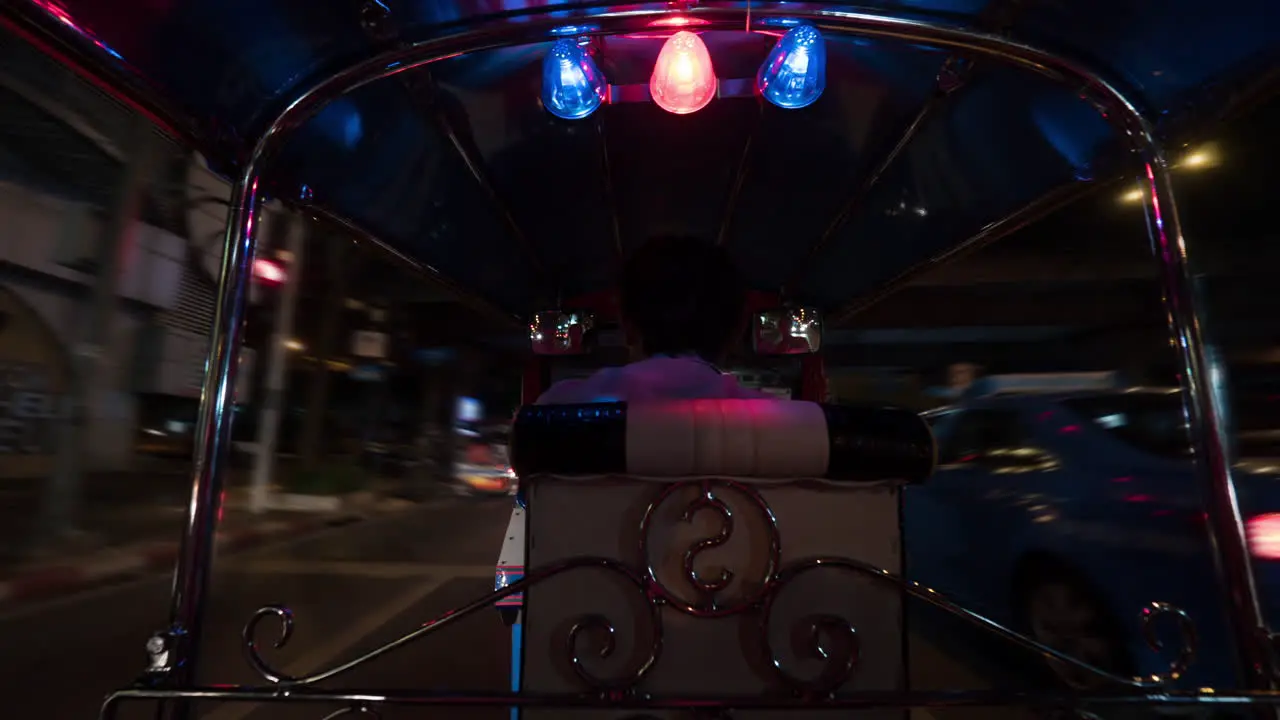 Timelapse of driving tuktuk in night Bangkok Thailand