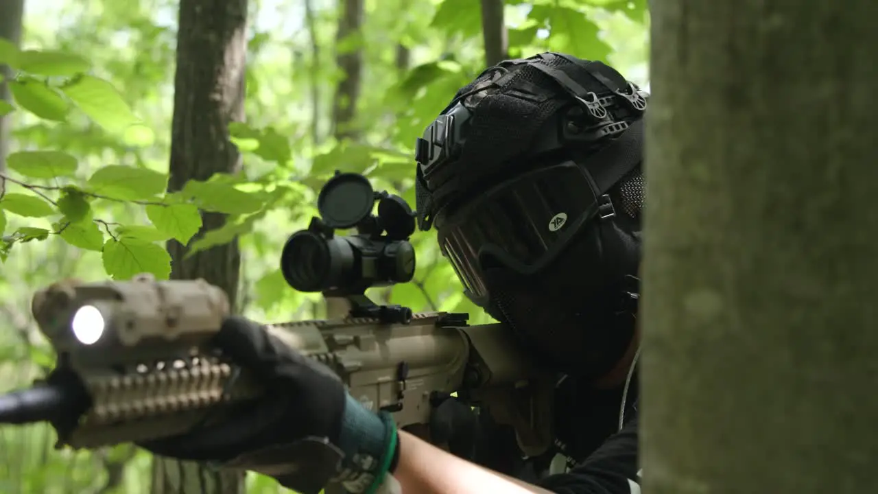 Slow motion tactical army guy brings gun up