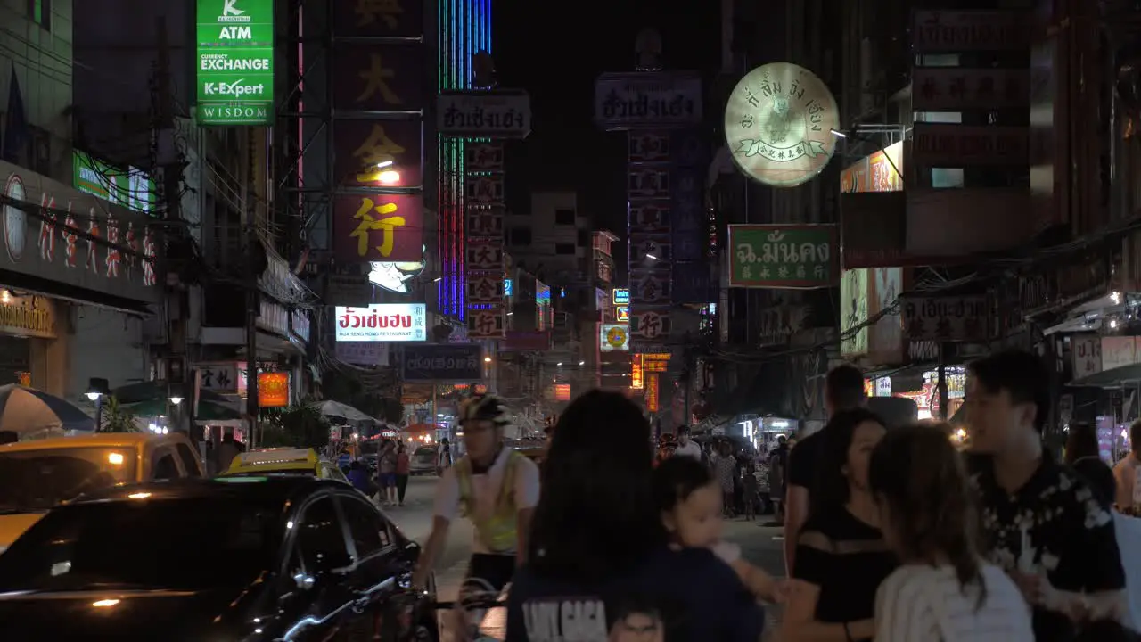 Crowded Chinatown with dense traffic at night Bangkok