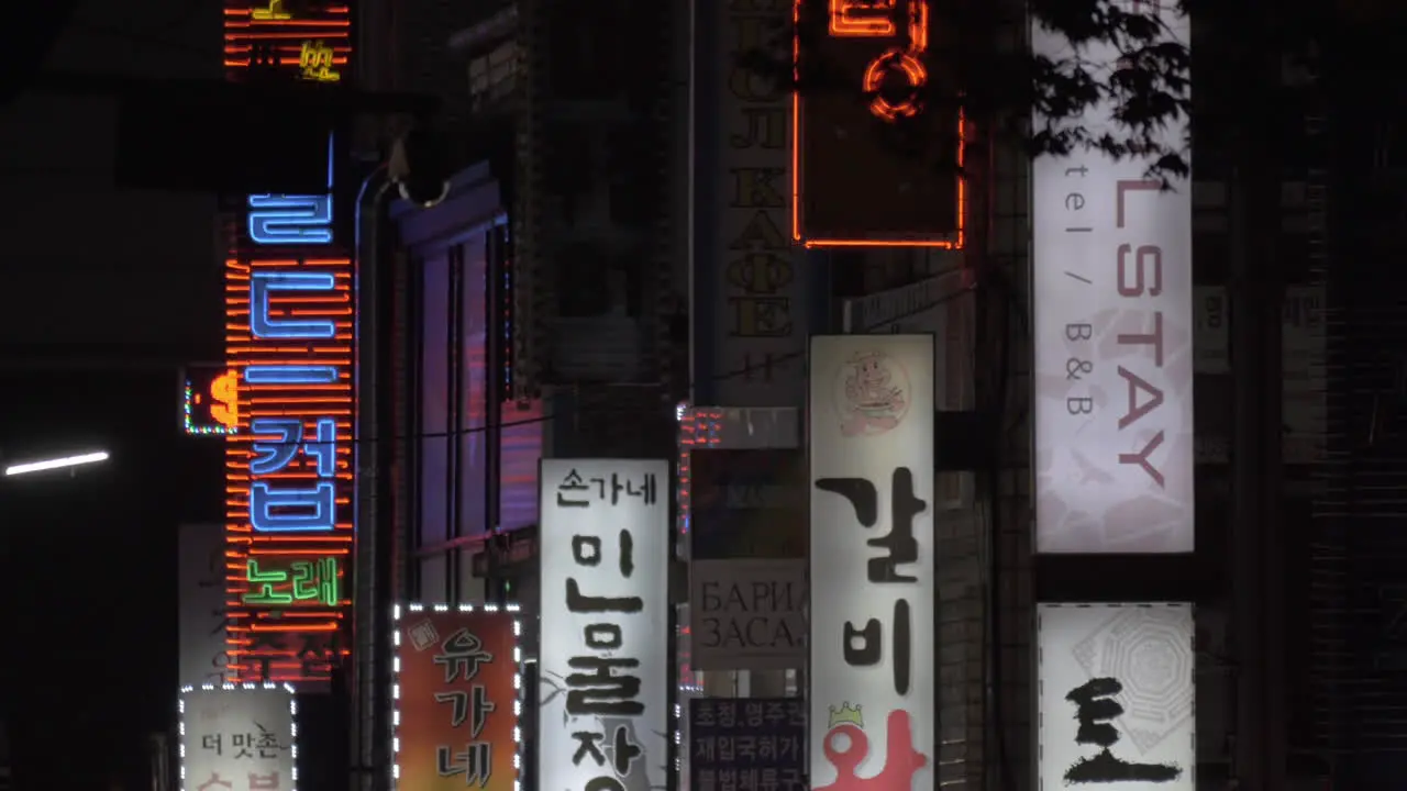 Store banners and cars passing by in Seoul South Korea