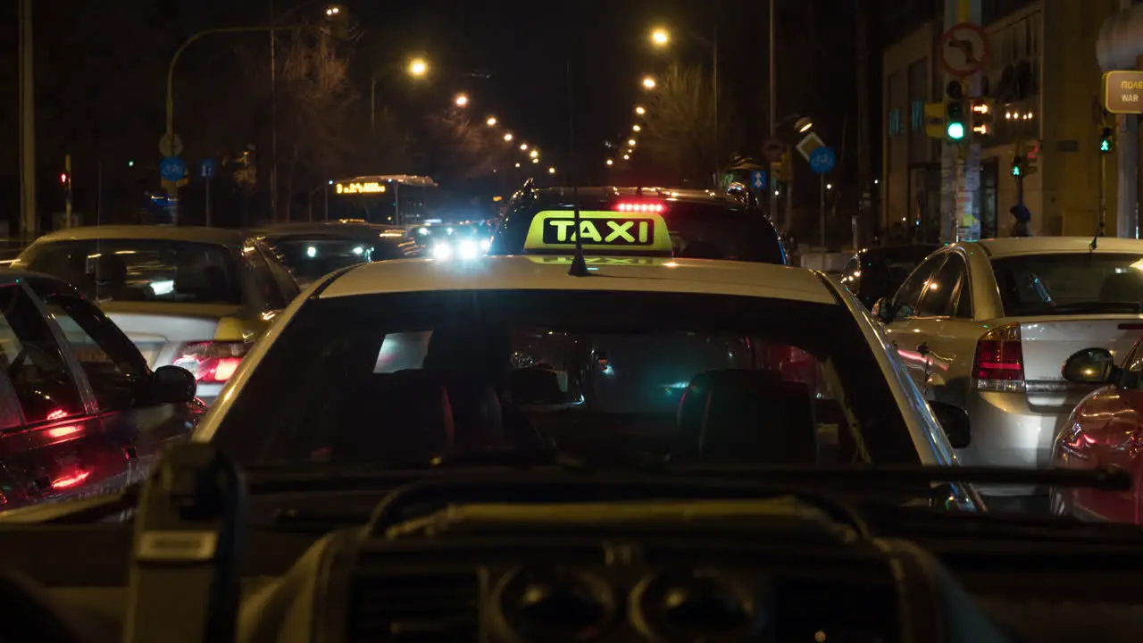 Timelapse of car driving in night city inside view