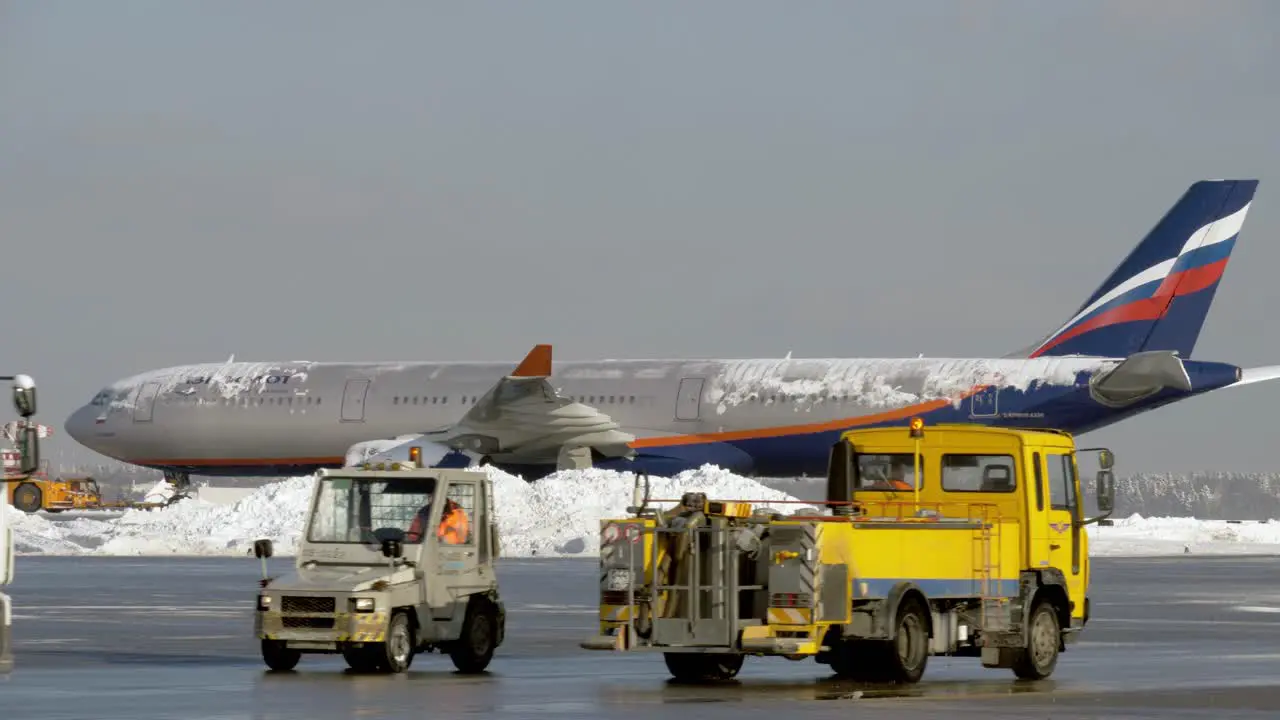 Towing Aeroflot aircraft covered with ice Russia