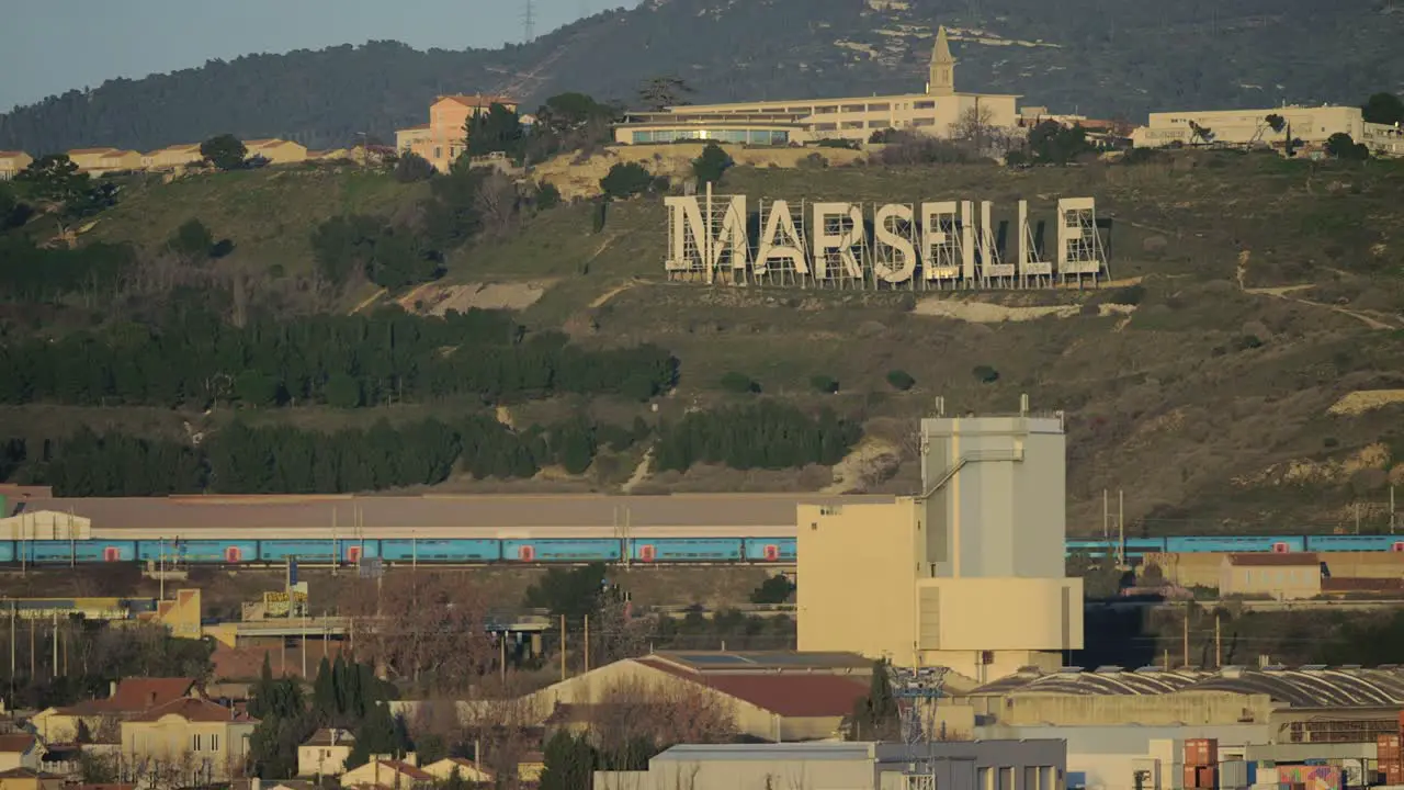 Marseille view with city name on green hills France