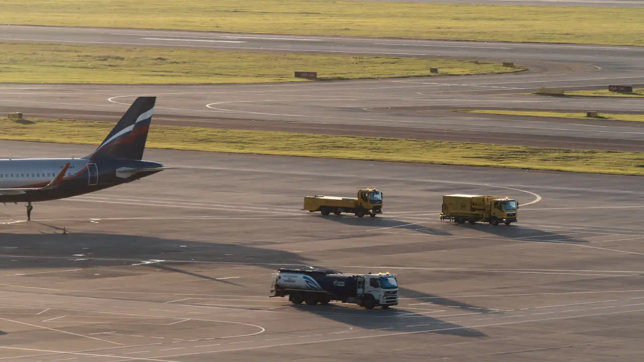 Aeroflot aircraft and trucks driving at Sheremetyevo Airport Moscow