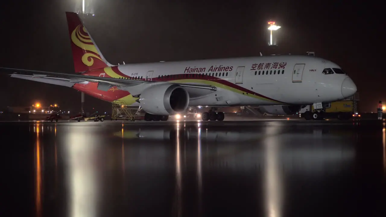 Hainan Airlines Boeing 787-8 Dreamliner parked in the airport at night