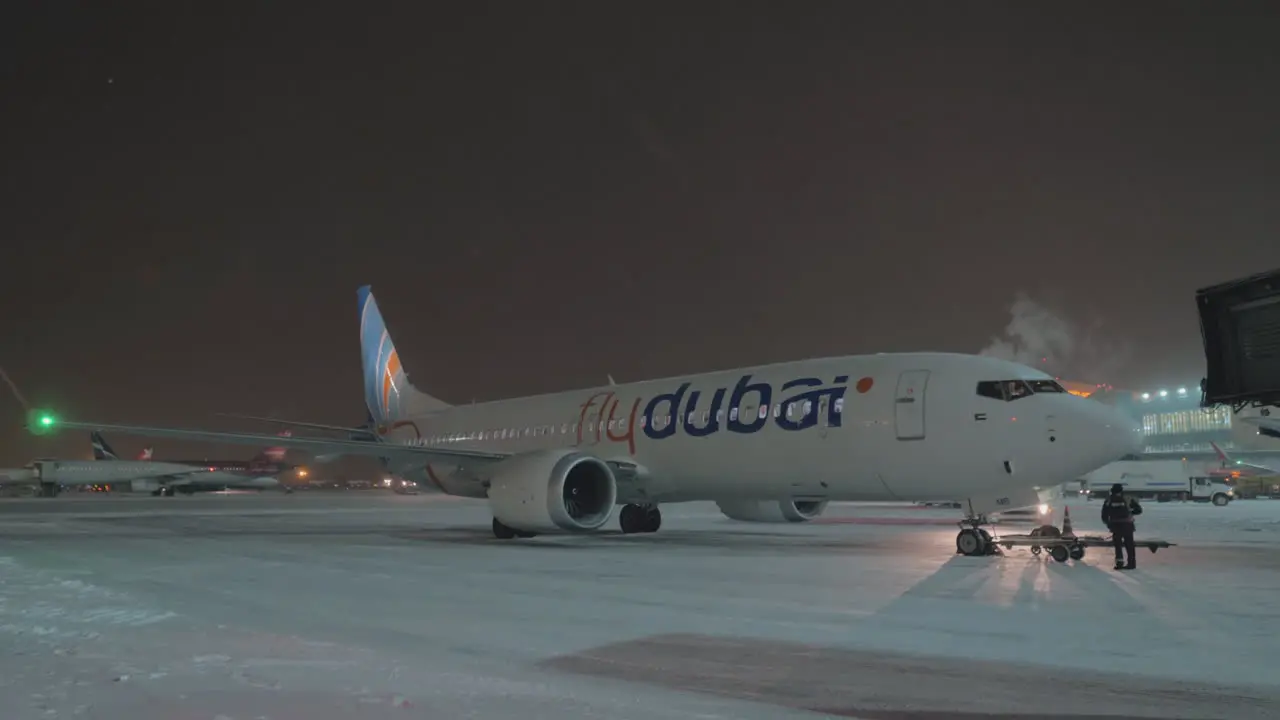 Flydubai aircraft in Sheremetyevo Airport at winter night Moscow