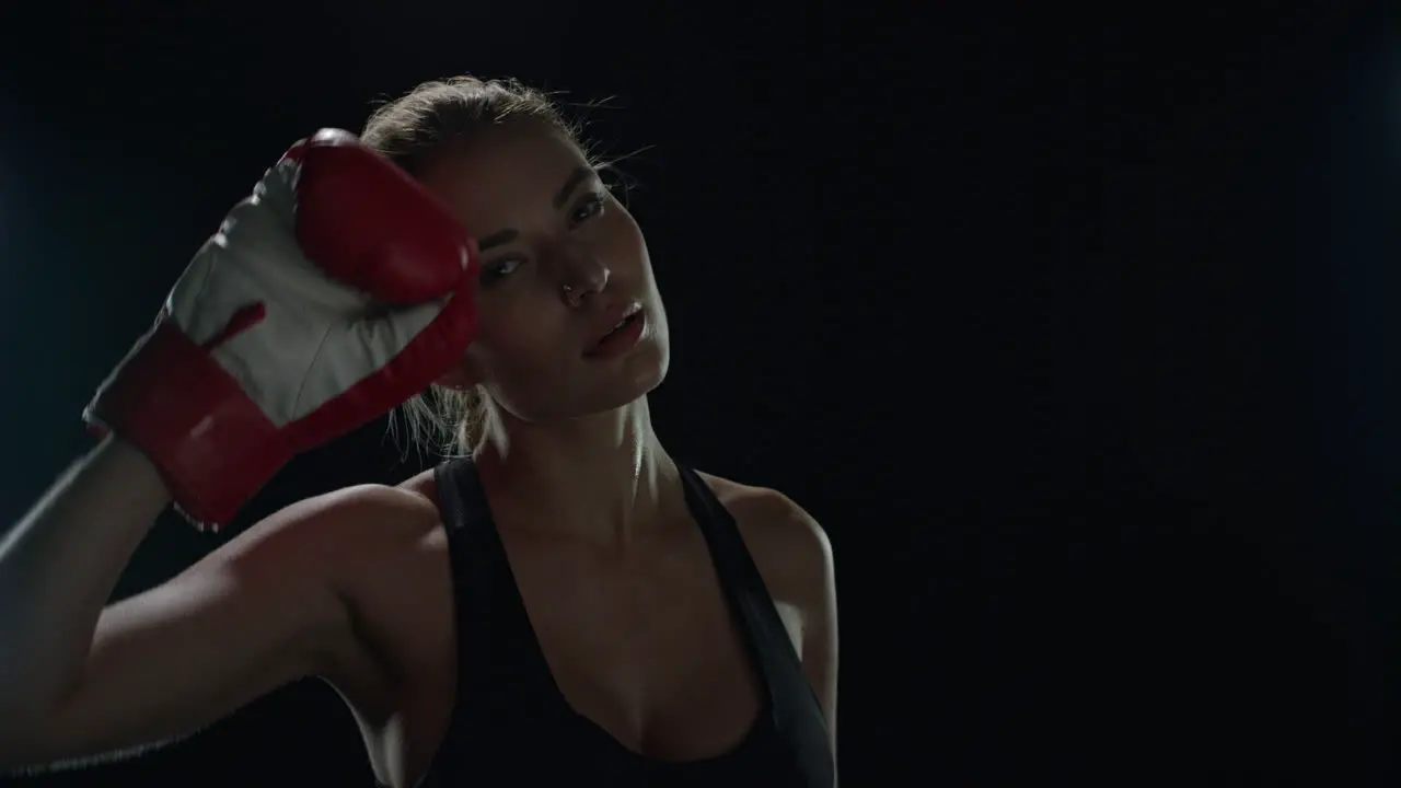 Exhausted woman boxer after sport workout