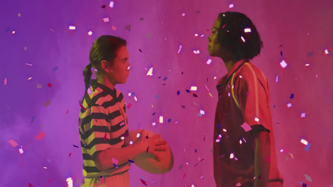 Animation of confetti over diverse female rugby players with ball