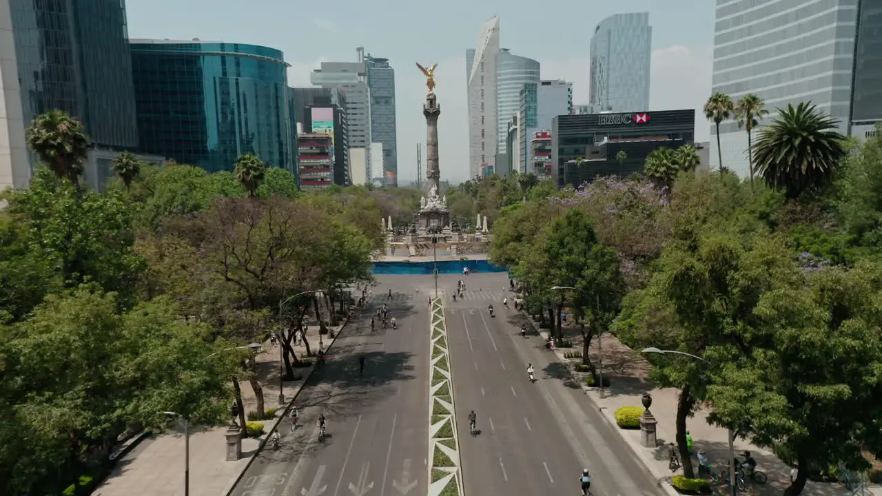 Aerial wide angle of paseo de la reforma street with cyclists at road